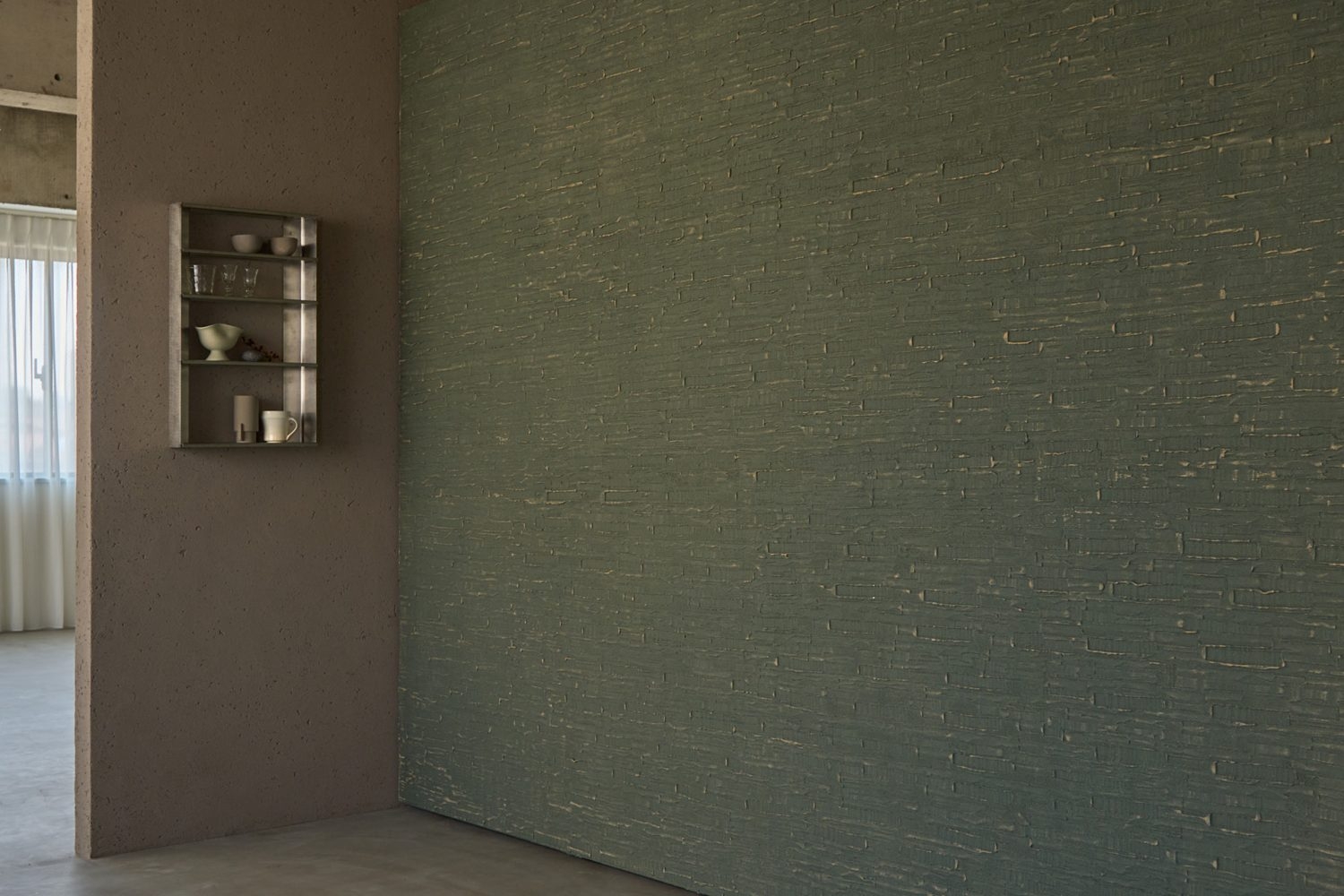 キッチン前に可動壁(グリーンカラーの面)を配置